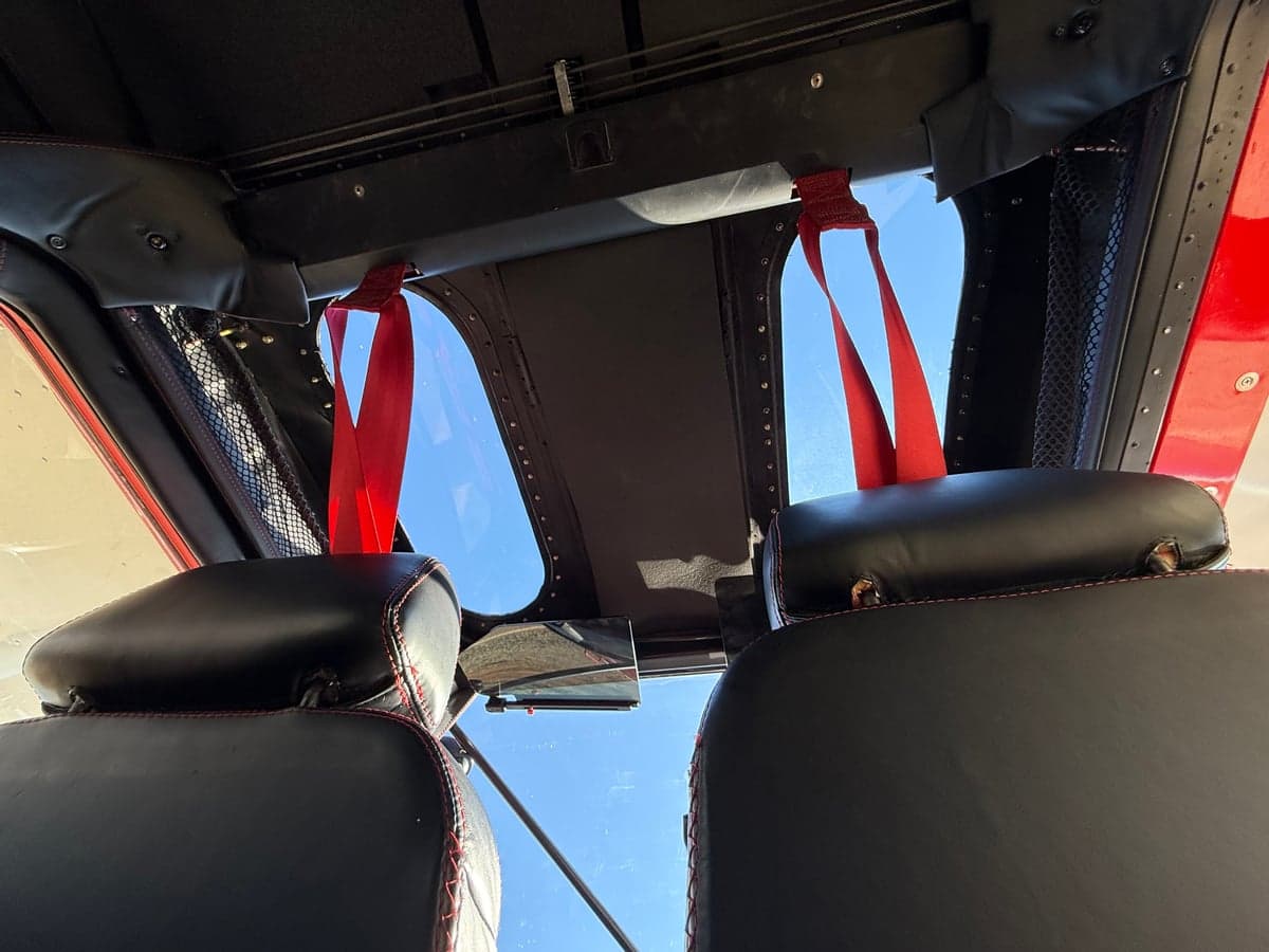 View of the aircraft interior showing the headrests and ceiling.