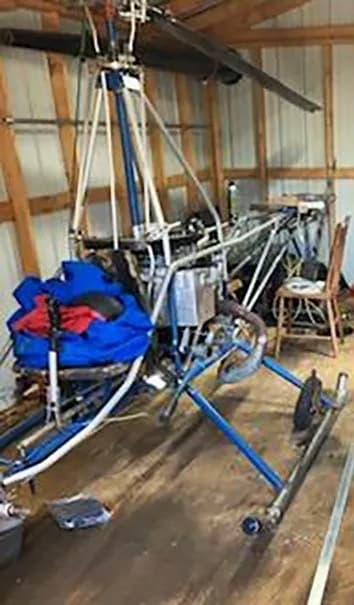 A/W-95 helicopter in a barn.