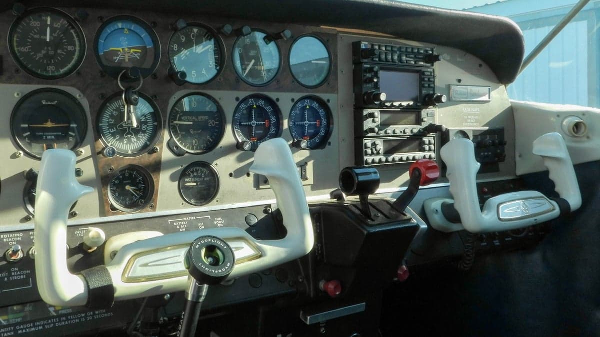 Detailed view of the aircraft's instrument panel and control yokes.