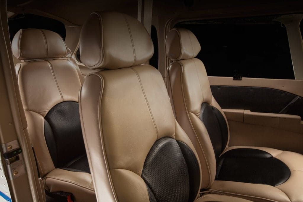 Close-up of the aircraft's front seats with tan and black upholstery.