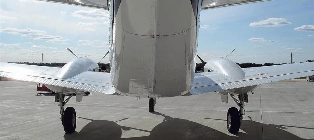 Rear view of a King Air aircraft on the ground.