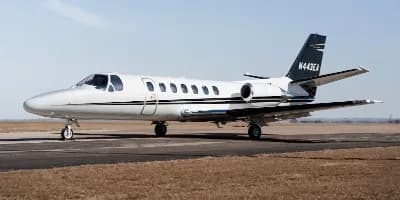 A Cessna Citation CJ3 is parked on the tarmac.