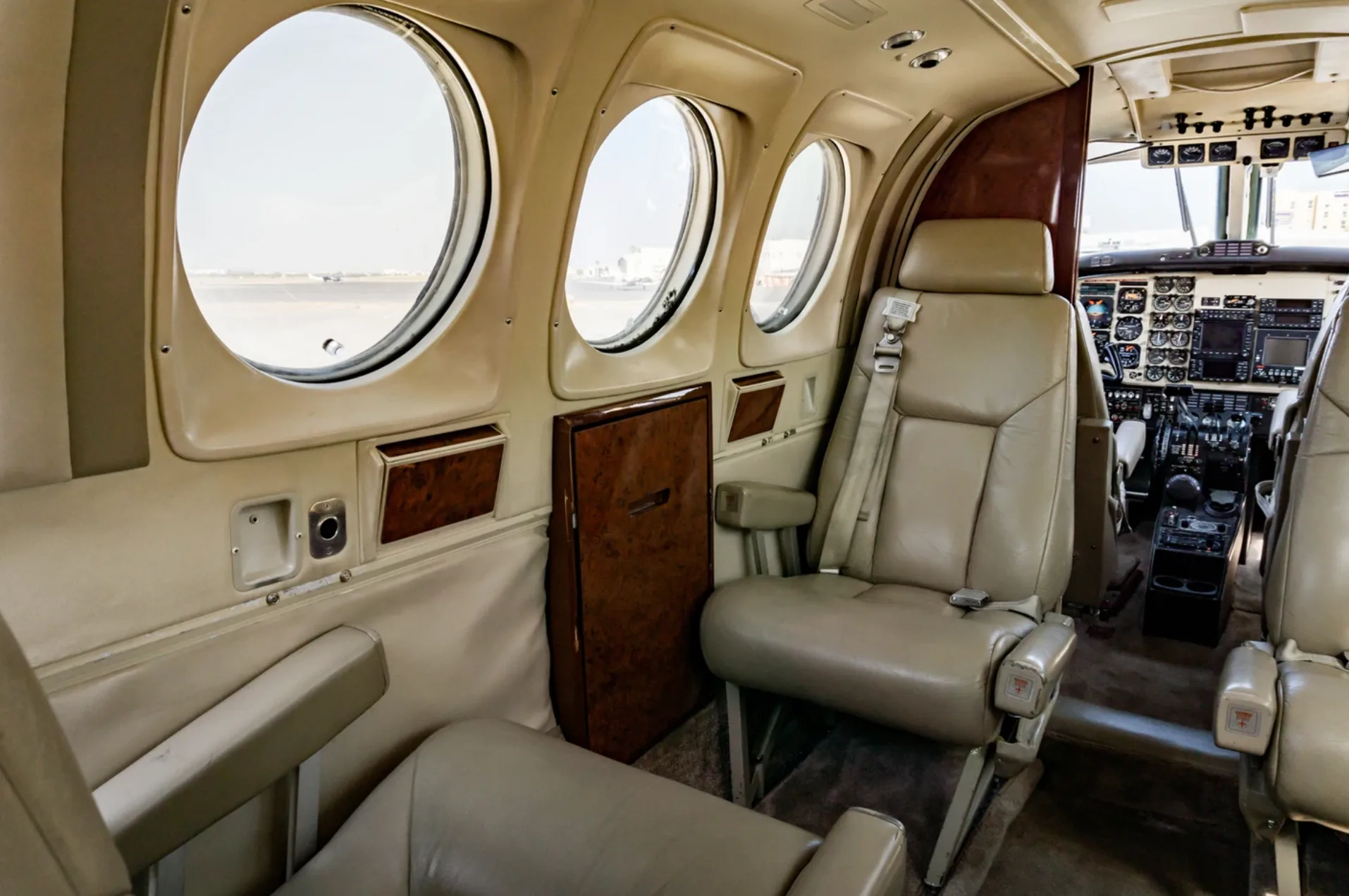 Interior view of the Beechcraft King Air 200 cabin showing seats and cockpit.
