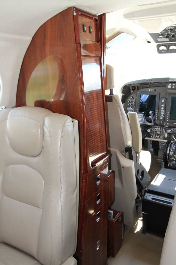 View of the cabin seats and cockpit of the aircraft.
