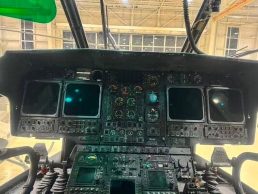 Close-up of the instrument panel inside the cockpit of a helicopter.