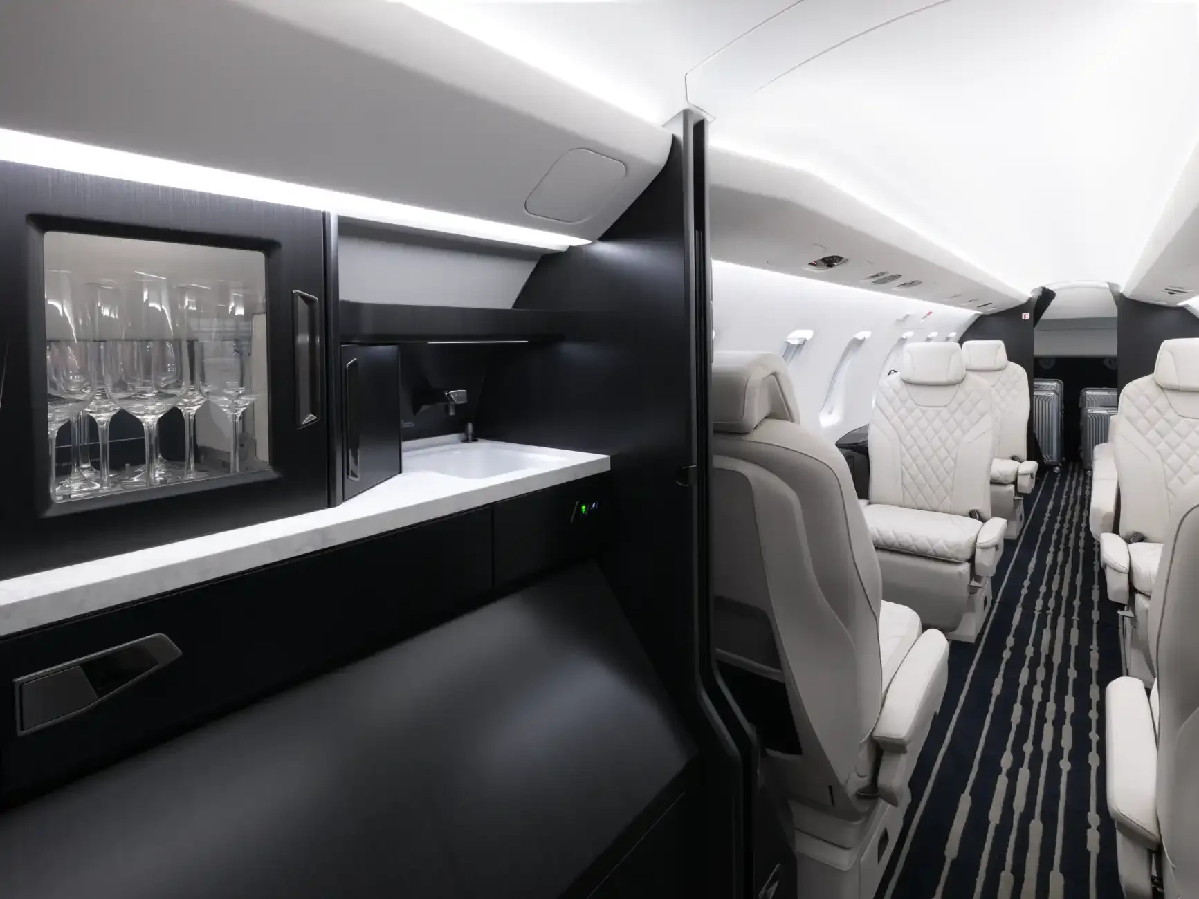 View of the aircraft interior with a bar and seating area.