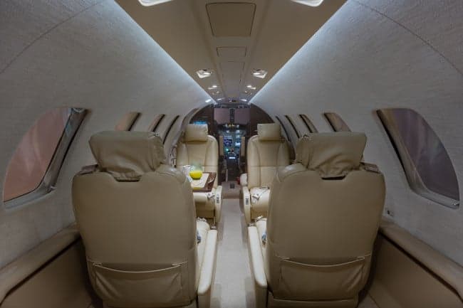 Wide view of the Cessna Citation CJ3+ cabin interior showing the seating arrangement.