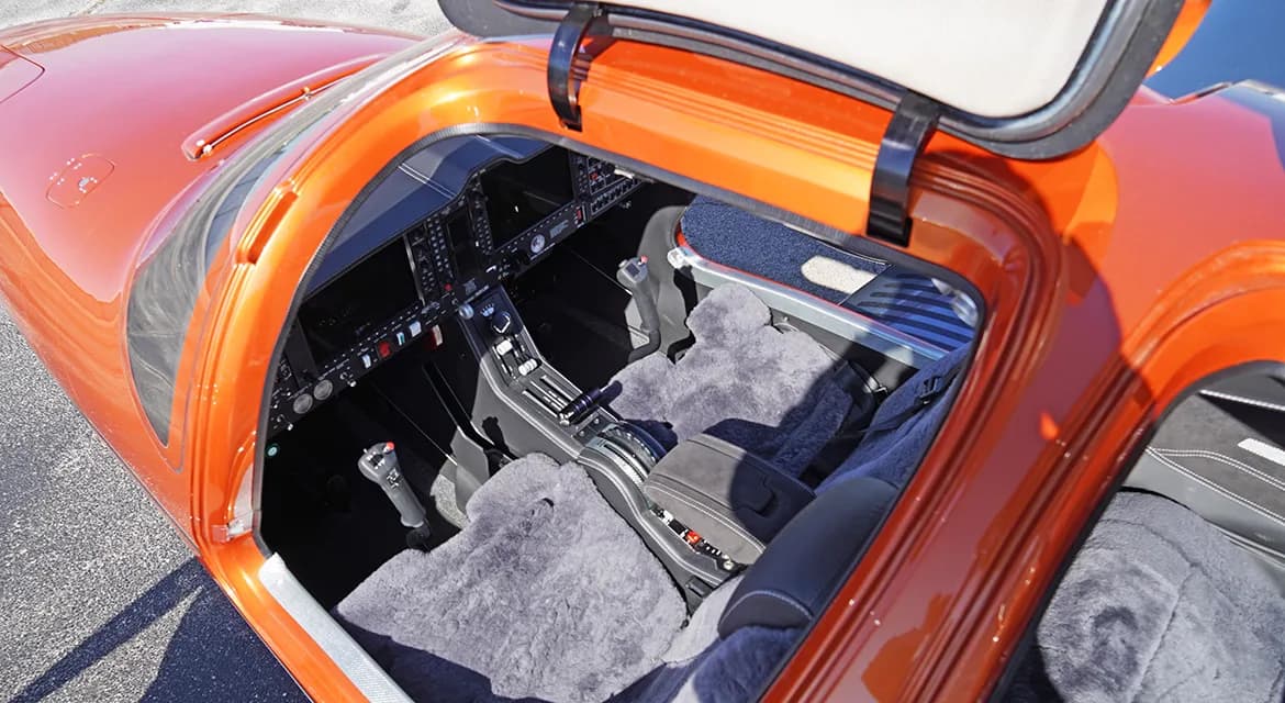 Interior view of the Diamond DA62 cabin with sheepskin seat covers.