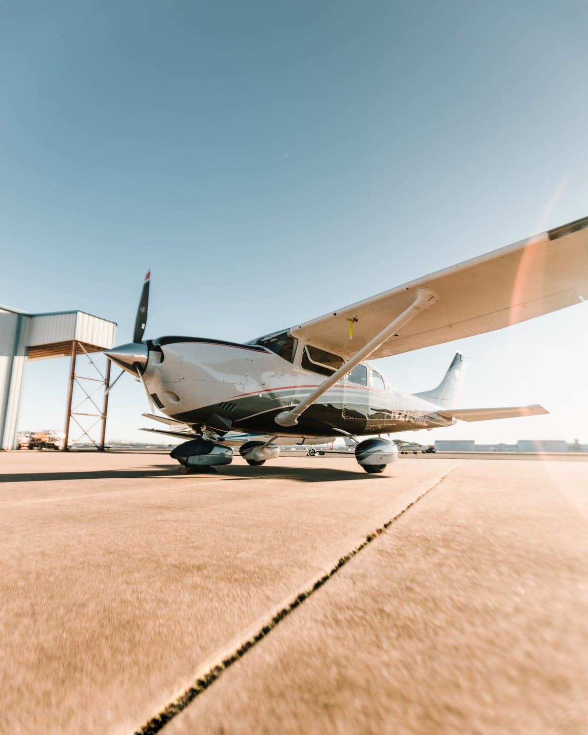 Low angle view of Cessna 206 Turbo Stationair TC aircraft N273ME on the ground.