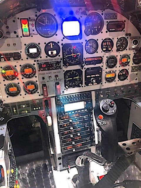 Close-up of the aircraft's instrument panel with various gauges and controls.