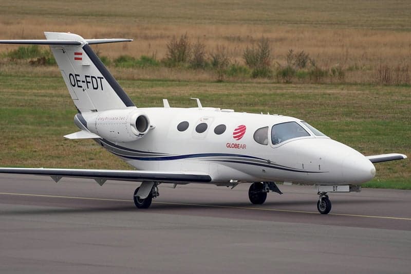 Side view of the OE-FDT aircraft on the ground.