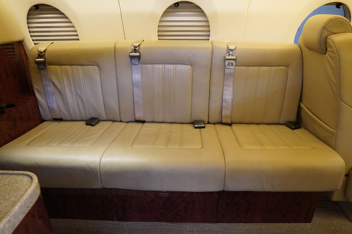 Close-up of a single seat in the aircraft cabin.