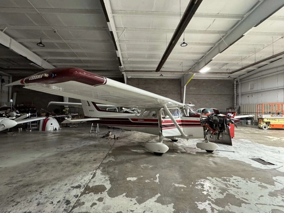 Cessna 172 N4855G in a hangar with engine work being performed.
