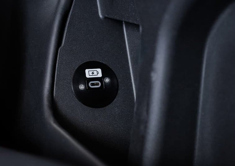 A close-up of a USB-C charging port with a battery icon.