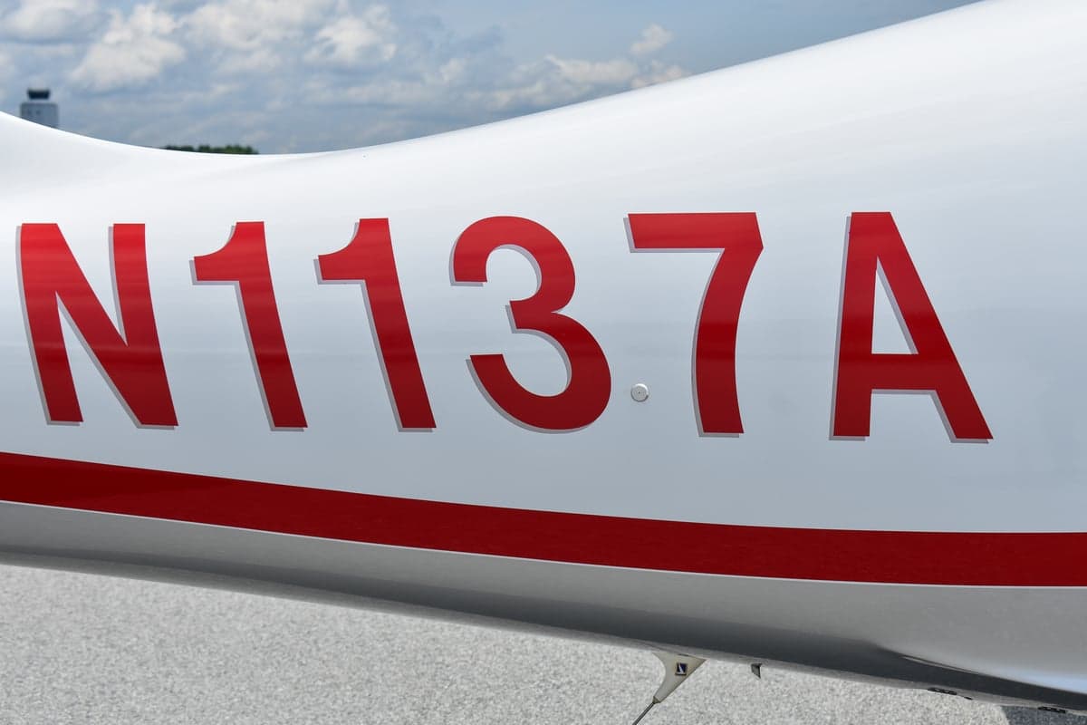Close-up of the Columbia 350 logo on the aircraft's exterior.