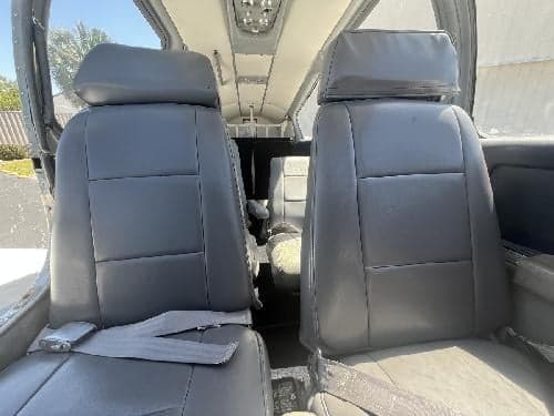 The interior of the Piper Aztec, showing the seats.