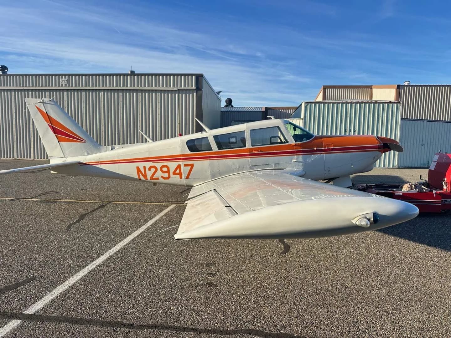 Side view of the N2947 aircraft on the tarmac.