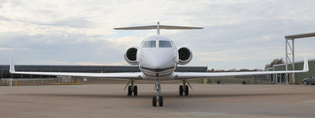 Front view of a Gulfstream G550 aircraft on the tarmac.
