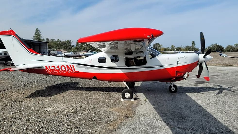 Side view of the N210NL Silver Eagle aircraft.