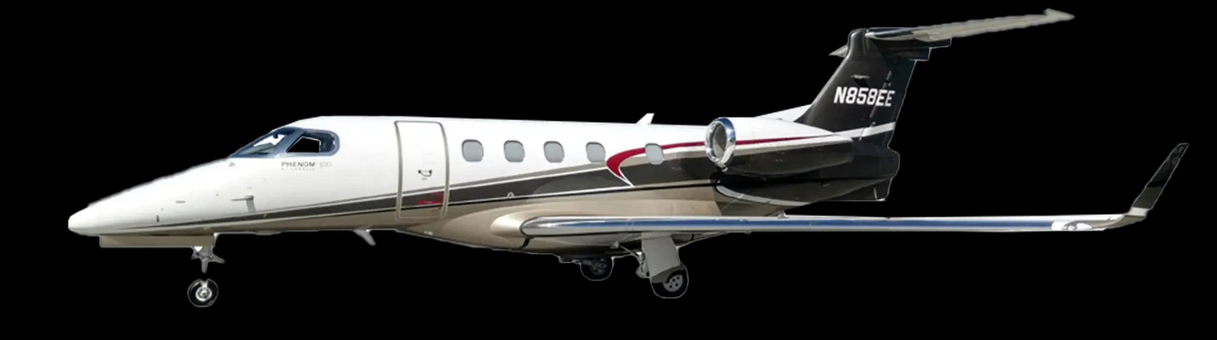 A white and black Embraer Phenom 100 business jet with tail number N858EE on a white background.