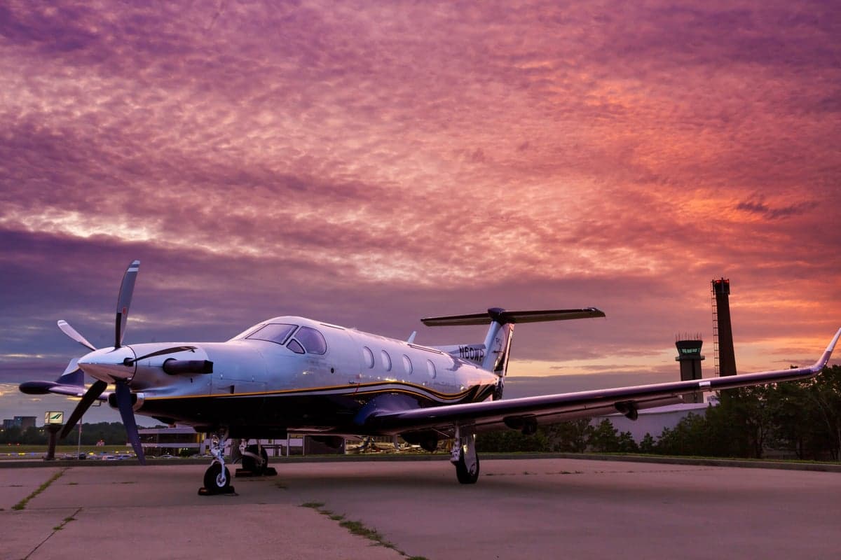 N60WP Pilatus PC-12 parked on the tarmac at sunset.