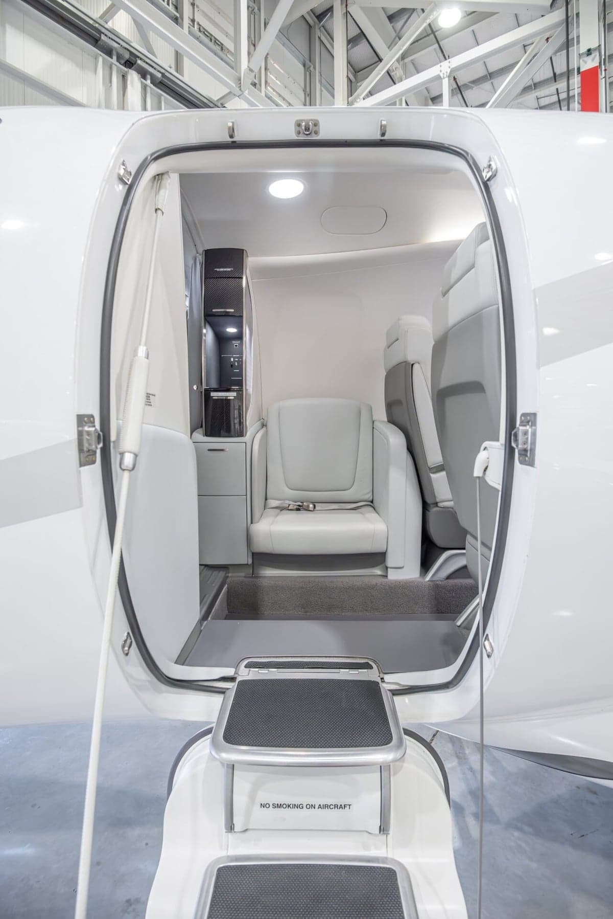 HondaJet HA-420 cabin interior with seats and side table.