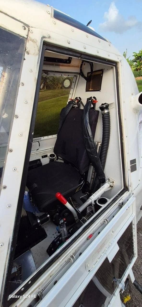 The interior cabin of a Thrush 510G aircraft, showing the pilot's seat and side controls.