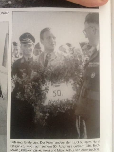 A group of German officers celebrating a pilot's 50th kill.
