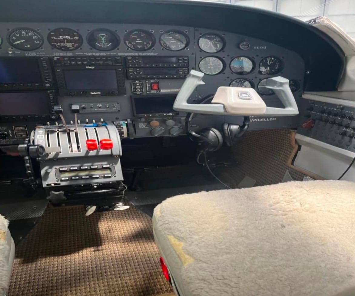 The cockpit of a Cessna 421 Golden Eagle aircraft with instrument panel and controls.