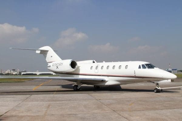 A Citation X aircraft is parked on the tarmac.