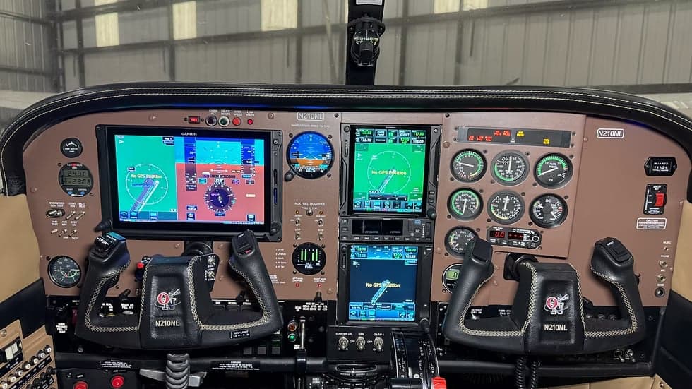 Detailed view of the N210NL aircraft cockpit instrument panel.