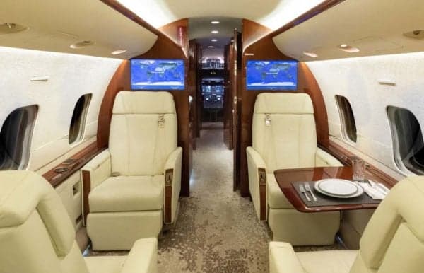 The interior of the Bombardier Challenger 300 features comfortable seating and luxurious amenities.