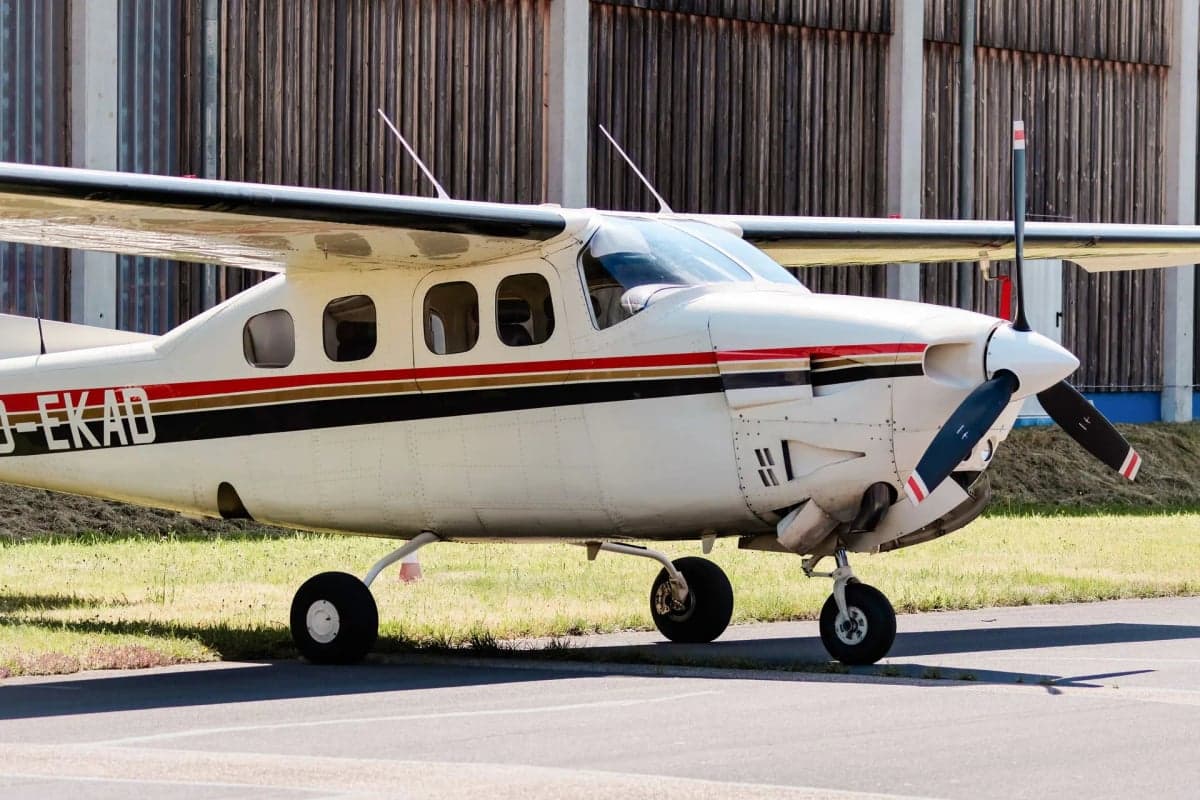 D-EKAD Cessna parked outside a hangar on a sunny day.