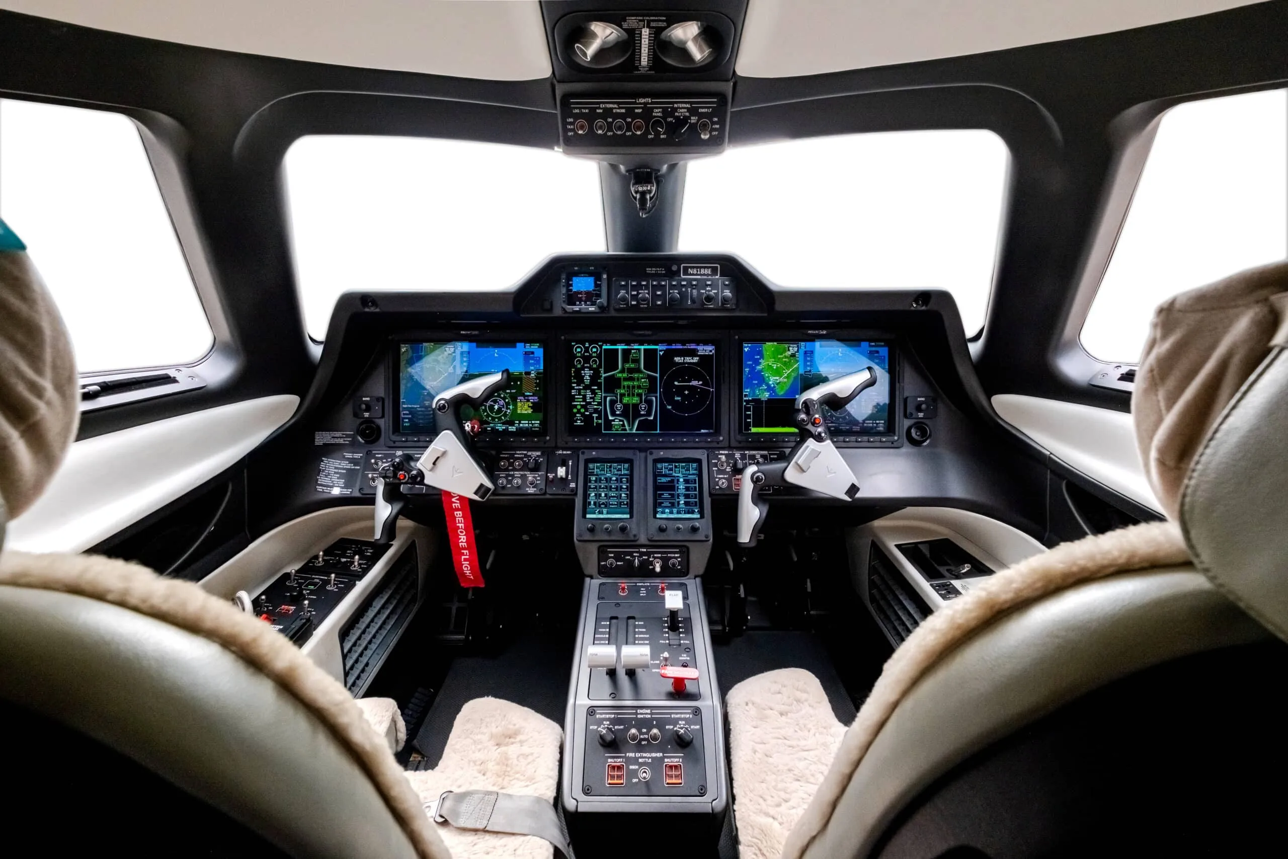 View of the aircraft cockpit with instrument panel and seats.