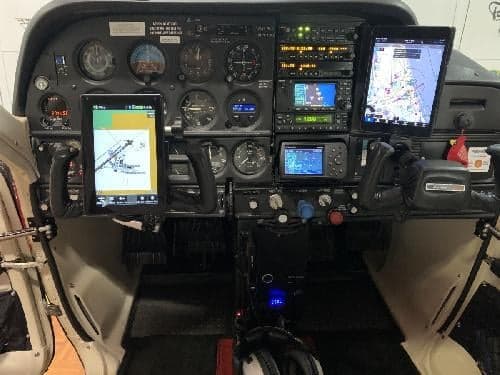 The cockpit of the aircraft features a full instrument panel and modern avionics.