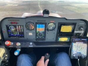 View of the aircraft's instrument panel from the pilot's perspective during flight.