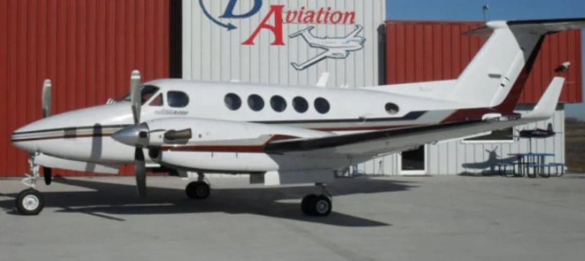 Side view of a King Air aircraft on the ground.