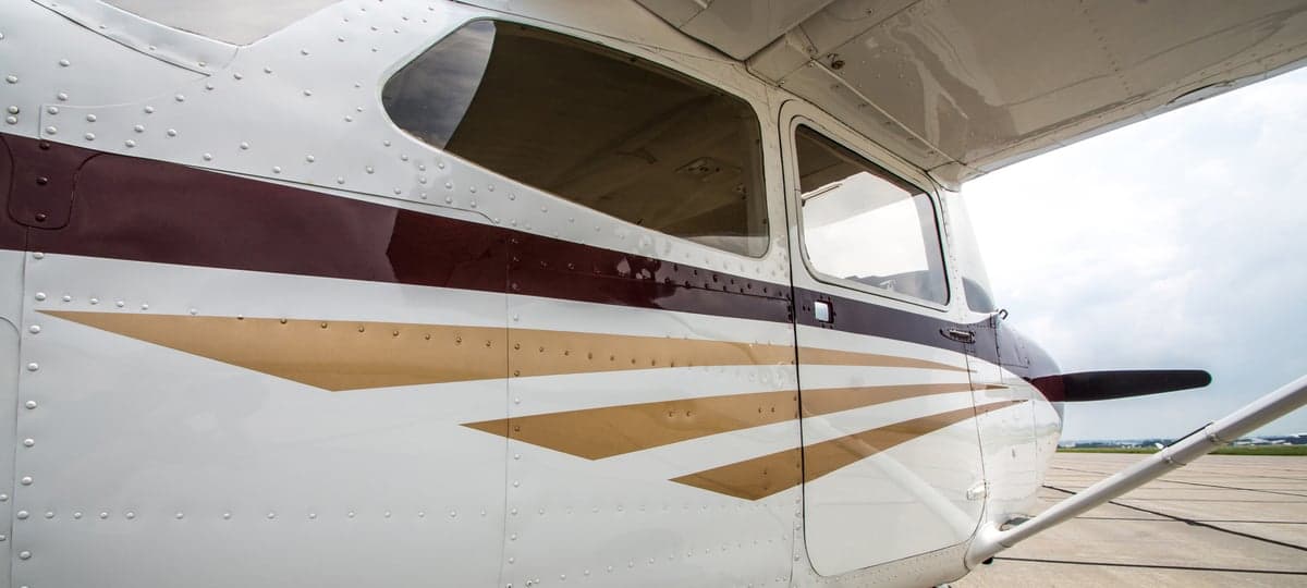 Rear view of the N6401V Cessna aircraft on the tarmac.