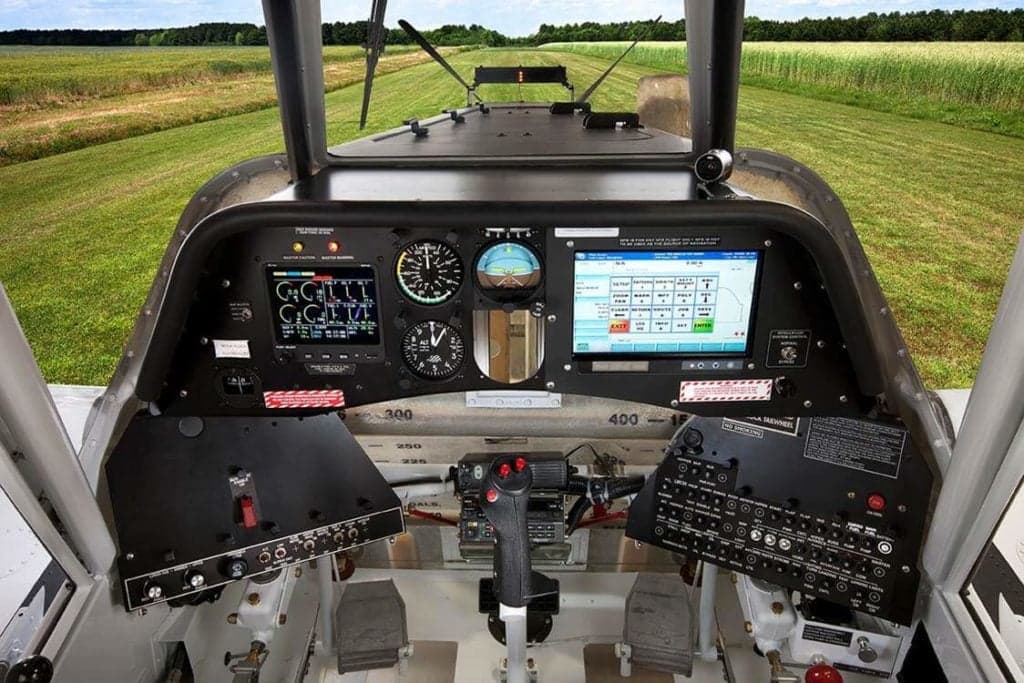 The cockpit of a Thrush aircraft with modern avionics.