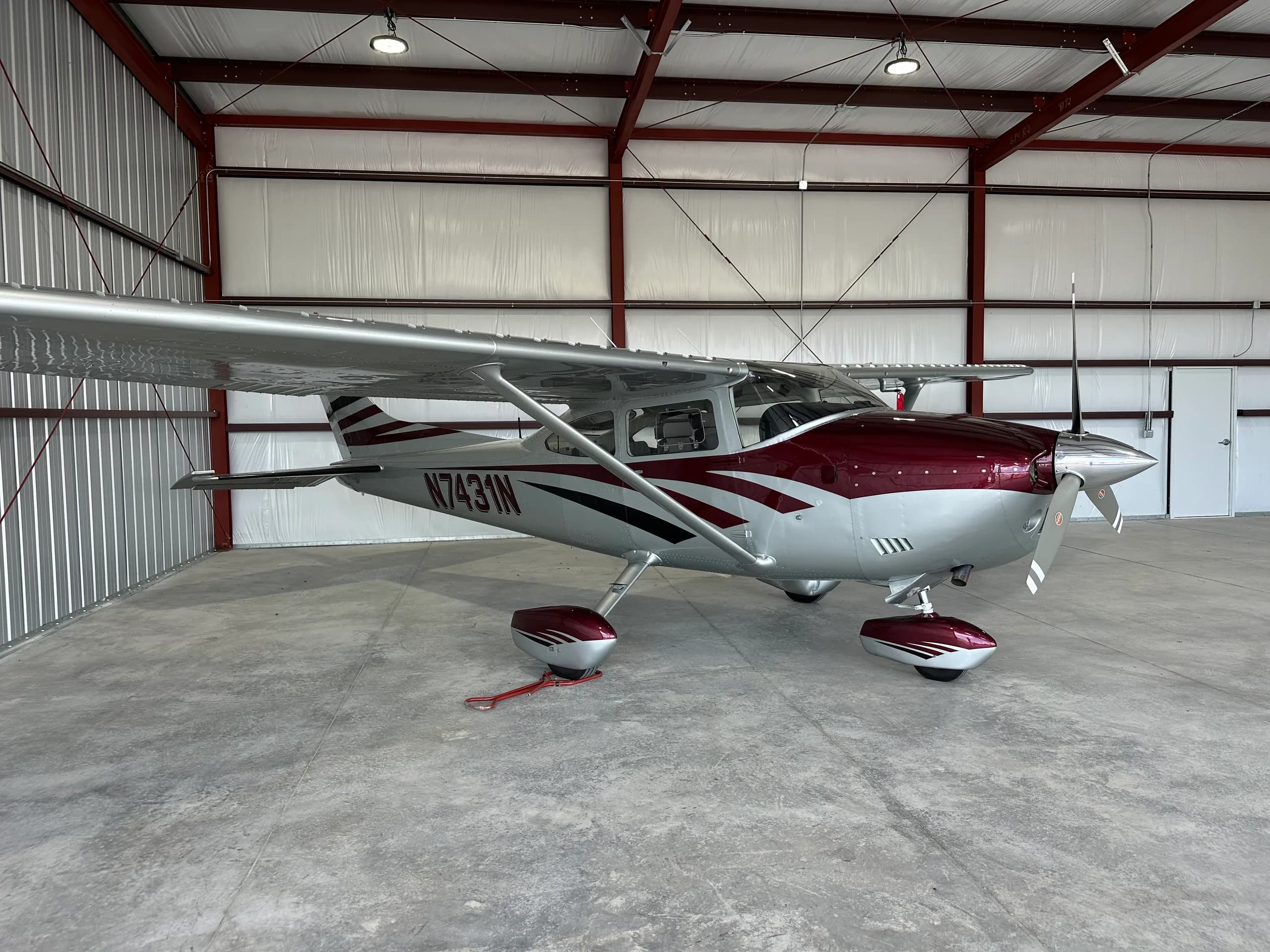 Cessna 182 Skylane N7431N parked inside a hangar.