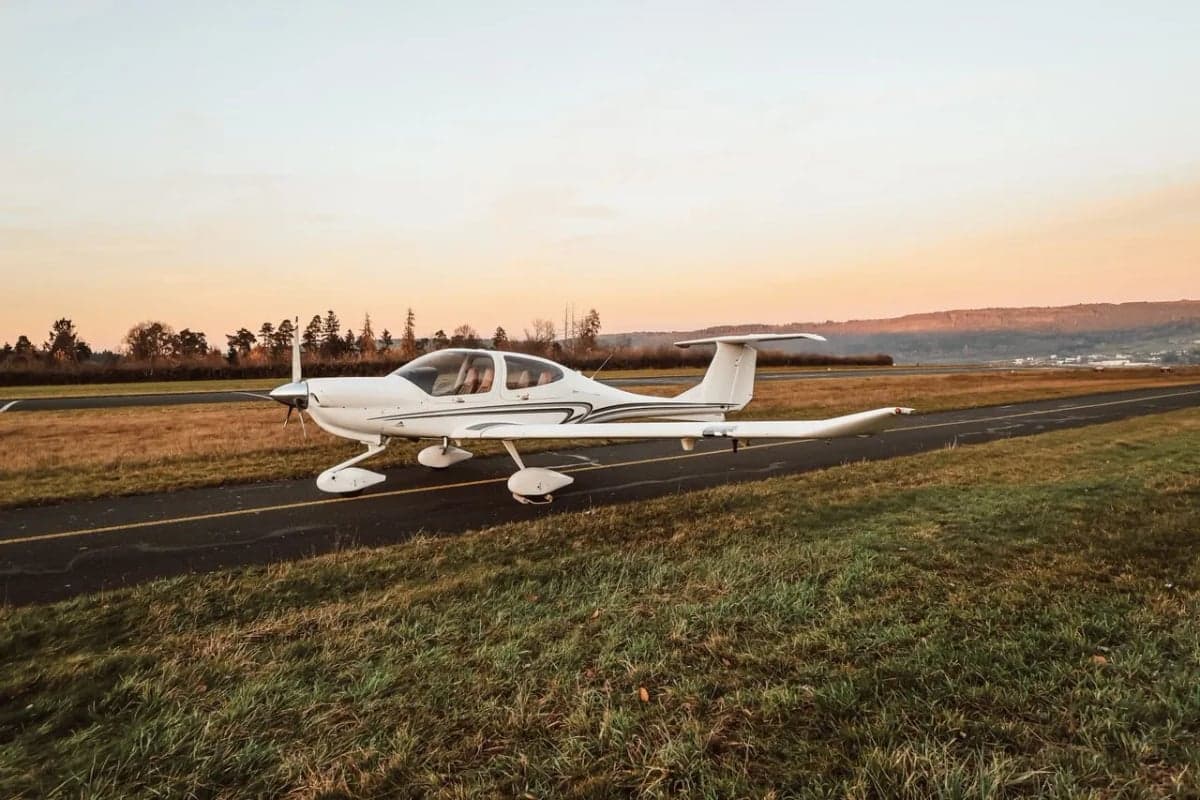 Diamond DA40 XLS on the runway at sunset.