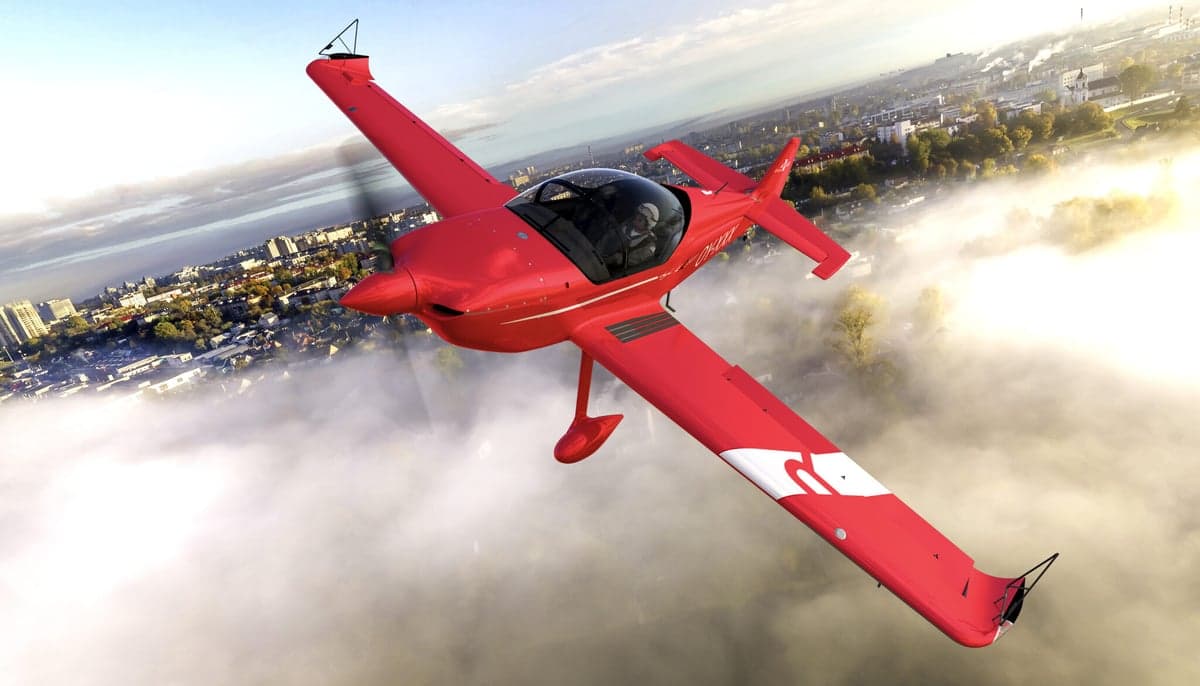 Aura Aero Integral R in flight over a city.