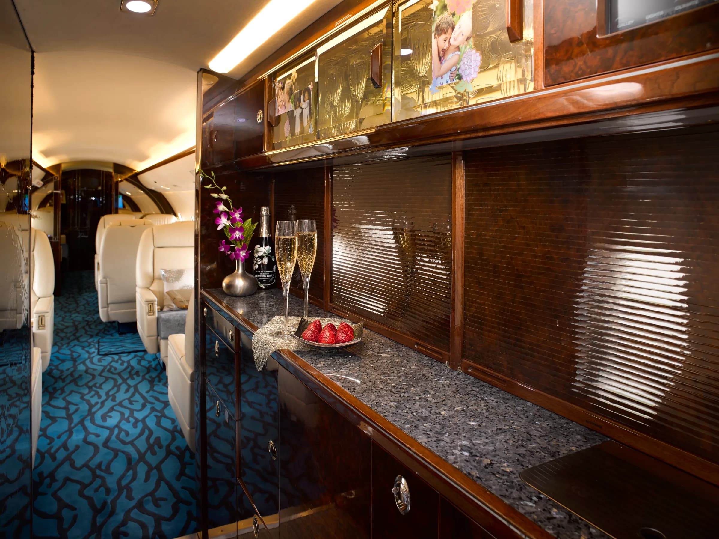 Galley area of the aircraft with a counter, cabinets, and refreshments.