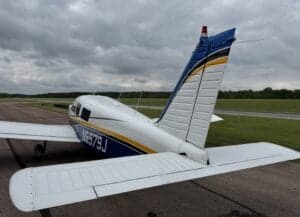 Rear view of the N5579J aircraft on the tarmac.