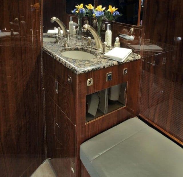 The aircraft's lavatory features a sink and vanity.