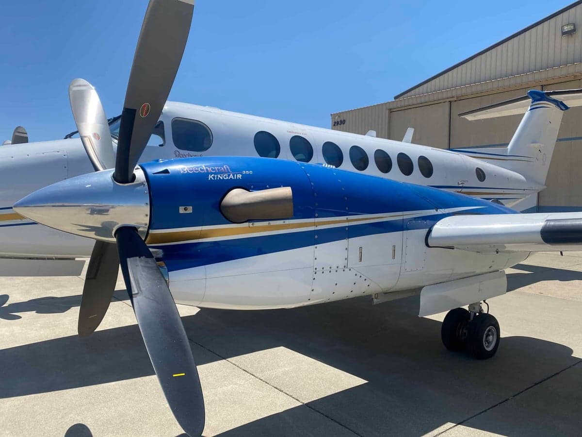 A side view of the right engine and propeller of the Beechcraft King Air 350, showing 'Beechcraft King Air 350' text on the cowling.