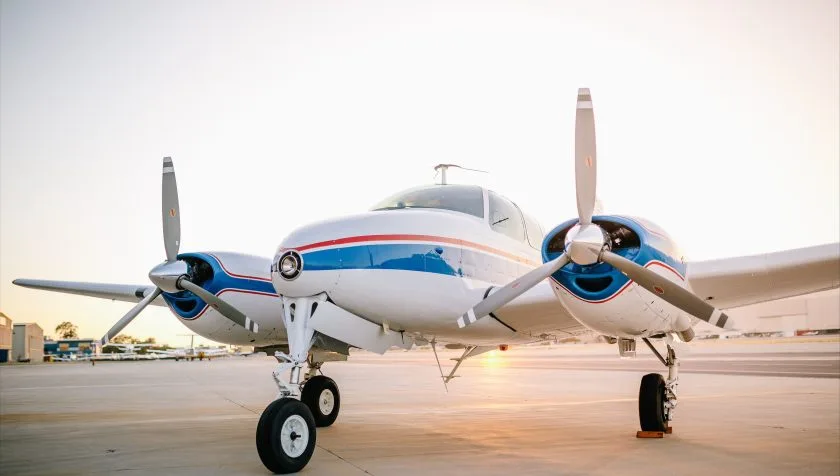 Front view of the twin-engine aircraft on the tarmac.