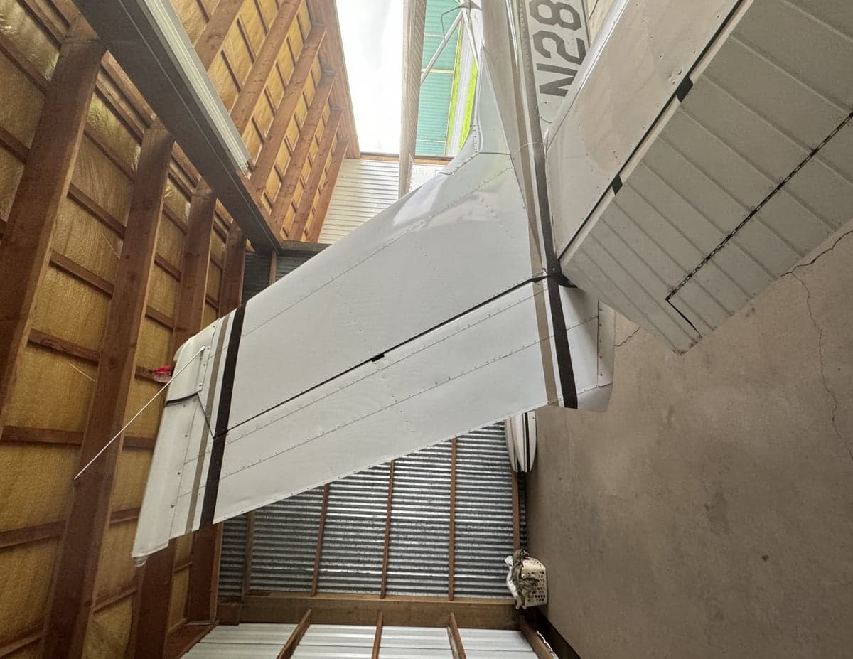 Horizontal stabilizer of a Cessna 172 in a hangar.