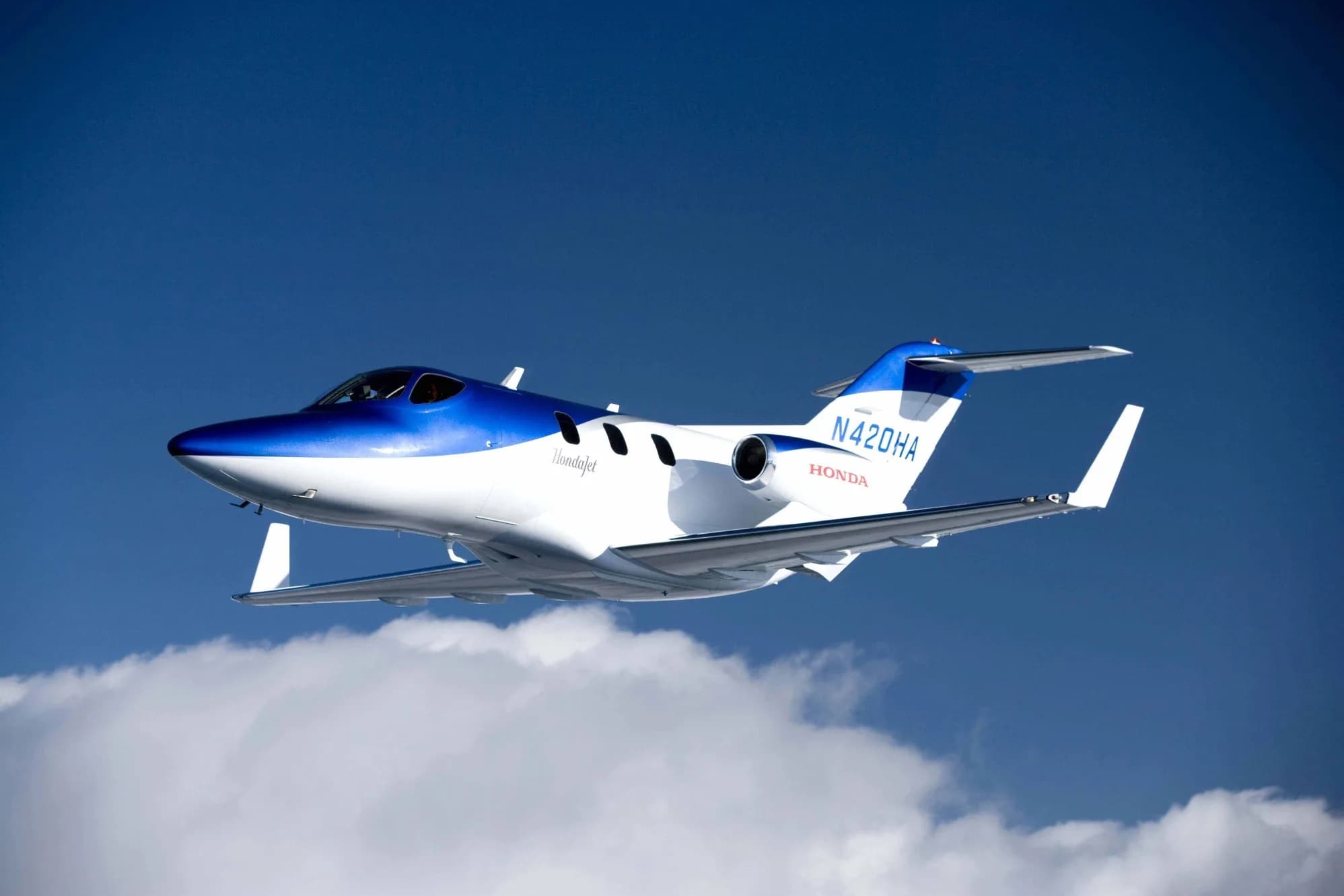 HondaJet flying in the sky.