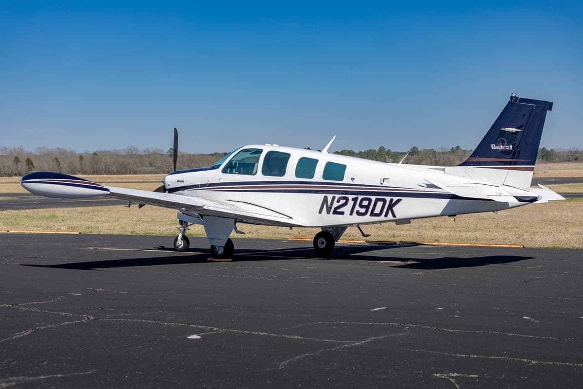 Side view of the Beechcraft Bonanza N219DK showing the tail number.